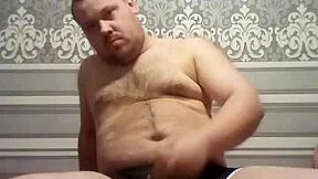 fat gay man stroking his handsome cock in solo action