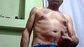 Serbian stud boldly strokes his hard cock in solo action.