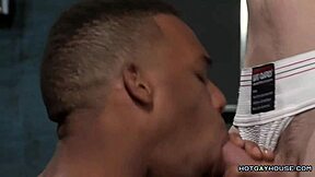 sexy black hunk interacts with white cock in interracial scene