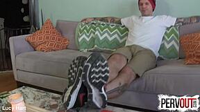 Tattooed guy creeps on feet in socks